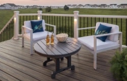 deck lights on metal post, illuminated post cap by lake, stair lights